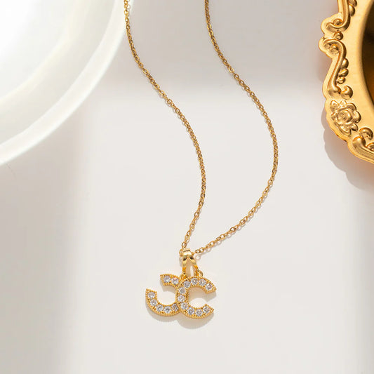 collier doré double C